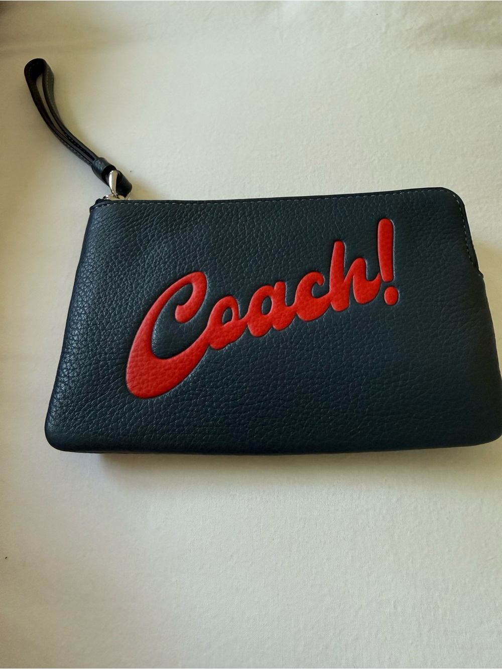 Coach  dark blue Wristlet with Red Script Logo